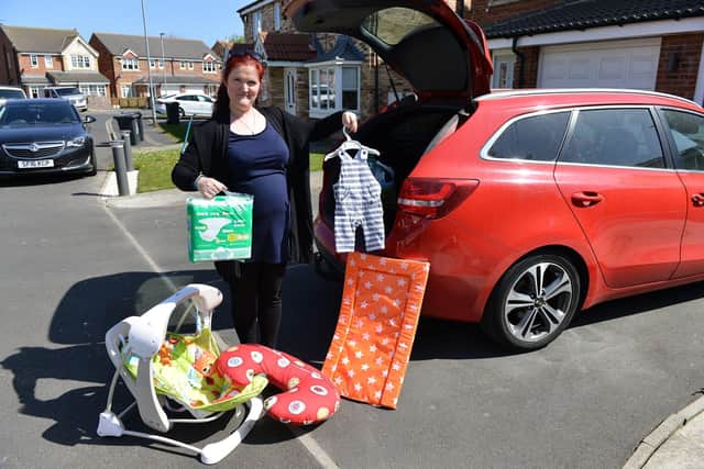 Emilie De Bruijn from Hartlepool Baby Bank loading items into her car ready for delivery. Picture by FRANK REID