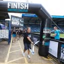 Jeff crosses the finishing line at Adam's Park, home of Wycombe Wanderers. Photo: Prostate Cancer UK
