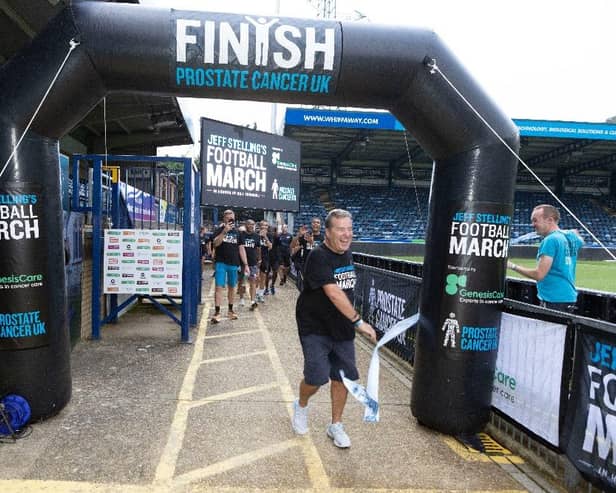 Jeff crosses the finishing line at Adam's Park, home of Wycombe Wanderers. Photo: Prostate Cancer UK