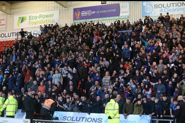 Hartlepool United  fans celebrate their win over Doncaster Rovers at the Keepmoat Stadium on 3rd February 2023.