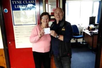 Olwyn Ward from Phoenix Showgroup presents a cheque for £200 to Hartlepool RNLI.