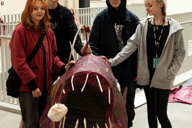 Extended Diploma Art and Design students from The Northern School of Art’s Middlesbrough campus with one of the mythical beasts they created for this year’s Wintertide festival. Photo: Joseph Harnett.