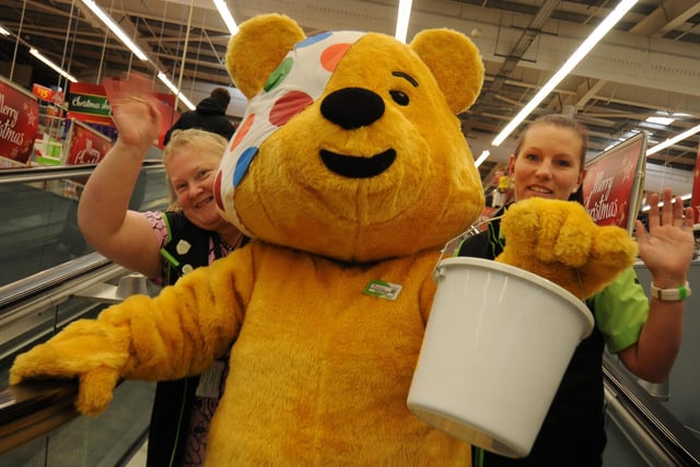 Pudsey found time to call into Asda at Peterlee and help with the fund-raising in 2014. The famous bear is pictured coming down the store's travelator with Asda staff Karen Bell (left) and Emma Denham.