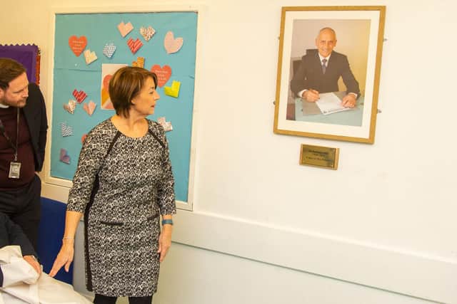 Judith Stannard, the late Gus Robinson's wife, in front of the Gus Robinson framed photograph after the unveiling ceremony. Picture by Tom Banks.