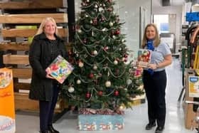 Jackie Gofton from the charity Human Kind collecting gifts last year from with MKM's Jane Plant.