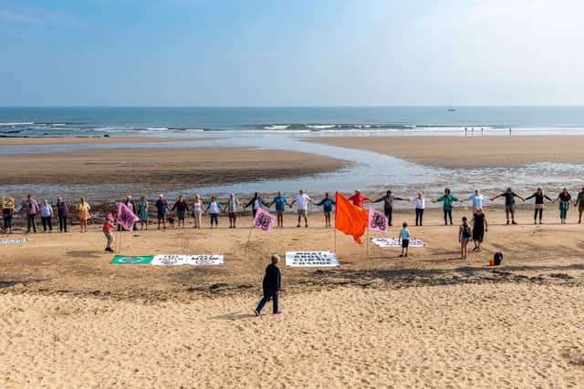 Dozens of people gather at Seaton Carew beach on Sunday to protest as part of 'wave to save our seas'.