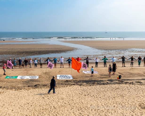Dozens of people gather at Seaton Carew beach on Sunday to protest as part of 'wave to save our seas'.