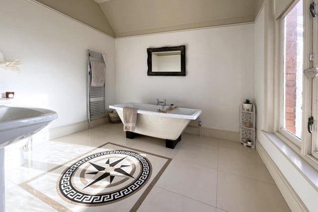 The stylish en-suite in the second bedroom is complete with a feature roll top bath. Picture: Rightmove.