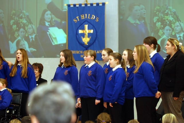 Pupils sing at the official opening of the school in 2001.