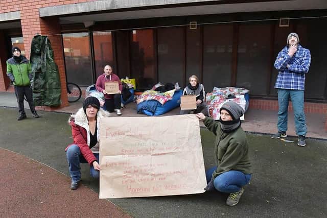 Lisa Alexander, front left, and Jaime Horton, front right, holding a sign raising awareness of homelessness with, rear left to right, James Bushnall, Rob Taylor, Josh Rutherford and Lee Flounders. Picture by FRANK REID