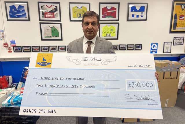 Hartlepool United chairman Raj Singh with the cheque for £250.000 to begin the appeal. Picture by FRANK REID.