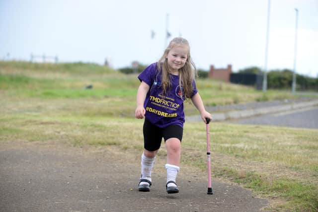 Dottie O'Keefe, six, steps out at the Miles for Men fun day following her operation.
