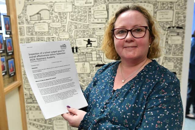 Rossmere Academy head teacher Caroline Reed proudly holds the school's Ofsted report following its most recent inspection in January.