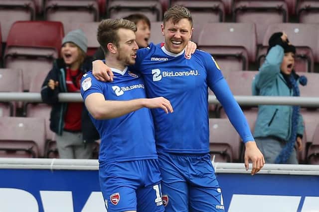 Richie Bennett of Morcambe celebrates with team mate Rhys Oates after scoring his sides goal during the Sky Bet League Two match between Northampton Town and Morecambe at PTS Academy Stadium on January 26, 2019 (Photo by Pete Norton/Getty Images)