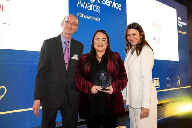 Lyndsay Hogg (centre) receives the extra mile award, sponsored by Descartes Systems, from Suzi Perry.