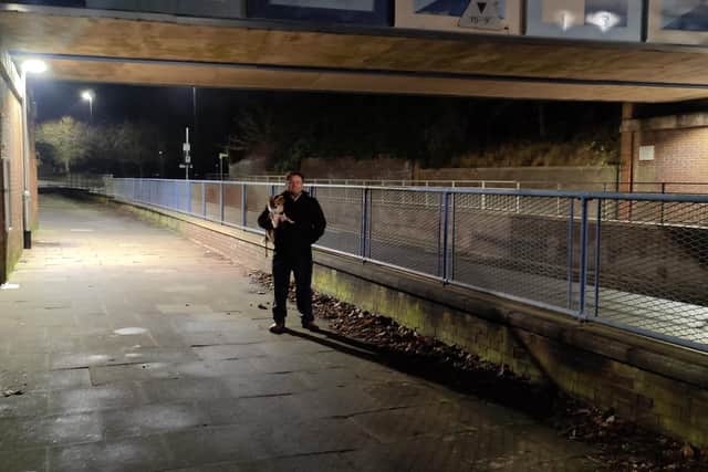 Cllr Cranney under the bridge with the new lighting.