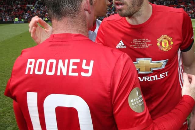 Michael Carrick and Wayne Rooney spent several years together at Manchester United.  (Photo by John Peters/Manchester United via Getty Images)