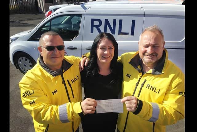 Faye Aspinall pictured with Hartlepool RNLI crew members Darren Killick(right) and Richard Shaw./Photo: RNLI/Tom Collins
