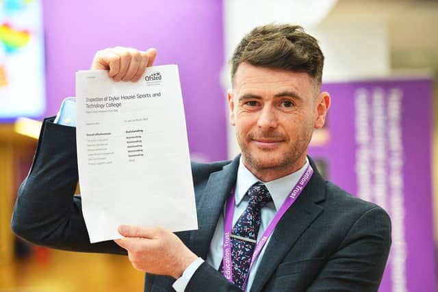 Adam Palmer, the principal at Dyke House Academy, with a copy of the school's 'outstanding' Ofsted report.  Picture by FRANK REID