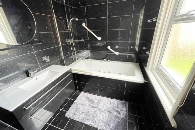 The bathroom is fitted with a Jacuzzi whirlpool bath.