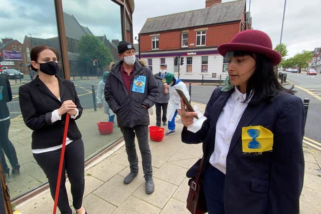 Extinction Rebellion member Jessica Maddison reading out a statement outside Barclays in Hartlepool. Picture by Frank Reid.