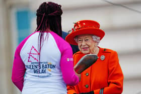 Kadeena Cox receiving the Baton from The Queen at the Queen's Baton Relay launch.