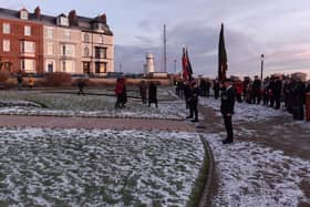 Standard bearers and members of the community in Redheugh Gardens at last year's Bombardment commemoration service.