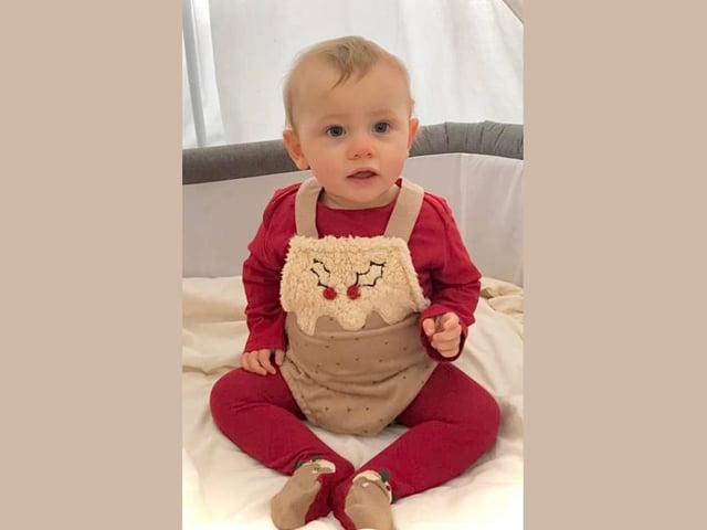 Esmae, age 9 months, ready to celebrate her first Christmas.