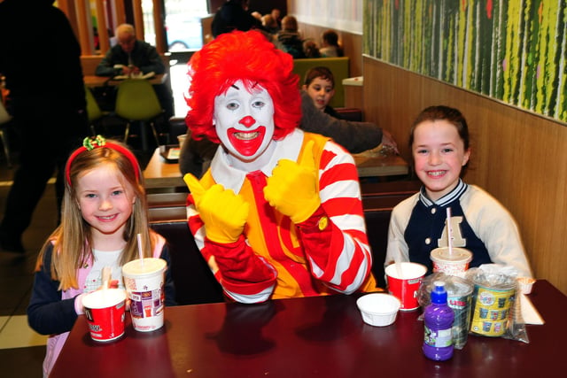 Ronald McDonald says hello to sisters Holly (left) and Grace Parker on his trip to McDonalds on the Marina in 2014. The restaurant held a fundraising afternoon to raise money for Springwell School.