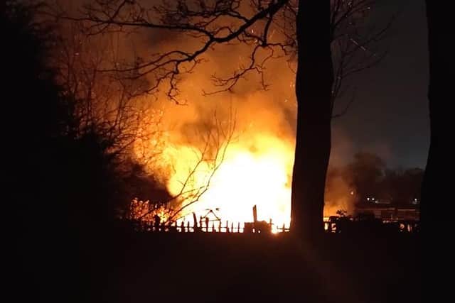 Four shed were engulfed by the flames on Sunday night./Photo: Simon Roberts