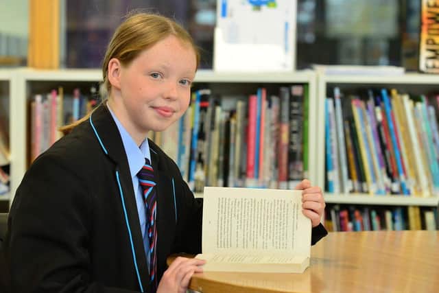 Dyke House Academy pupil Eve Stuart, reading in the library. Reading was one of the points praised in the Ofsted report. Picture by FRANK REID