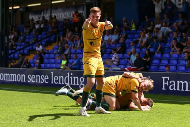 Mark Shelton of Hartlepool United celebrates after Rhys Oates scores his team's first goal during the Vanarama National League Play-Off Semi Final match between Stockport County and Hartlepool at Edgeley Park on June 13, 2021 in Stockport, England. (Photo by Charlotte Tattersall/Getty Images)