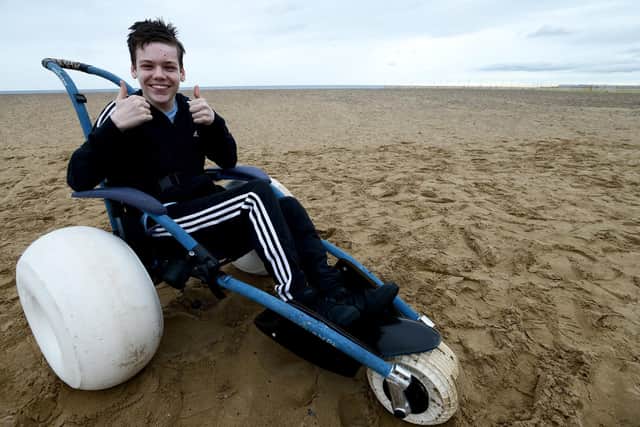 High Tunstall College of Science pupil Alfie Smith sits in a "wide wheel" wheelchair that allows him full access to the Beech at Seaton Carew to complete his GCSE course work.