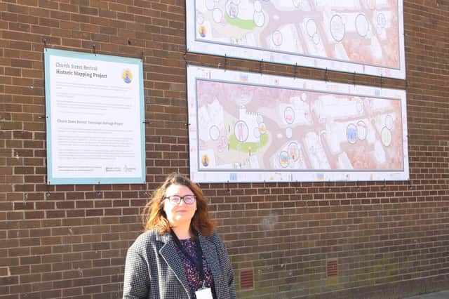 Emma Ackroyd, the council’s townscape and heritage project officer, by the new banners in Church Street.