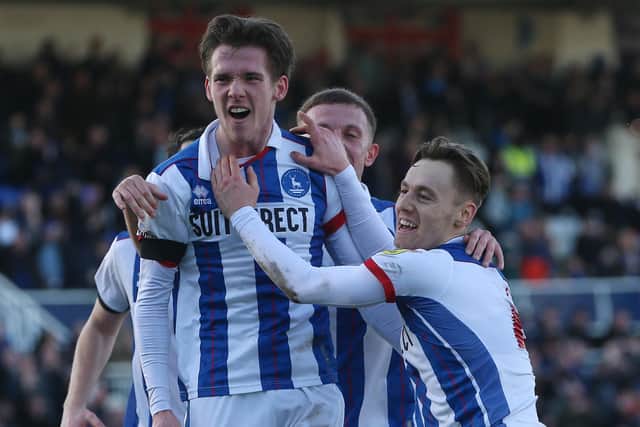 Daniel Dodds of Hartlepool United celebrates with his team mates after scoring their second goal to level the score at 2-2. (Photo: Mark Fletcher | MI News)