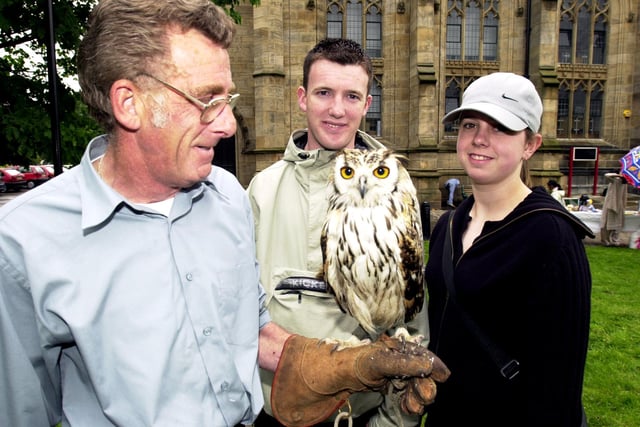 Ray Galloway with one of his birds, an Bengal Eagle Owl watched by Richard Leaver and Lisa Gill pictured back in 2002