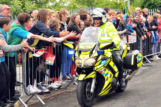 It's high fives from the police bike outriders as the Olympic torch relay arrives in Peterlee.