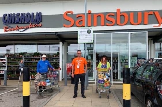 Alan Lakey of Rotary Hartlepool, Neil Whales of Sainsbury’s and Rev Roz Hall after the trolley dash for the church food bank.