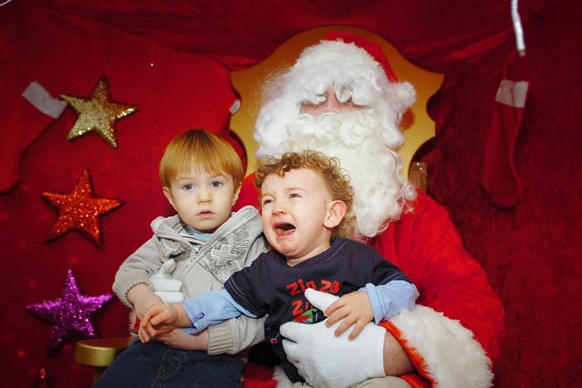 Harry Willingham and a tearful Finley Hammond with Father Christmas during their visit to the Middleton Grange shopping centre grotto in 2007.