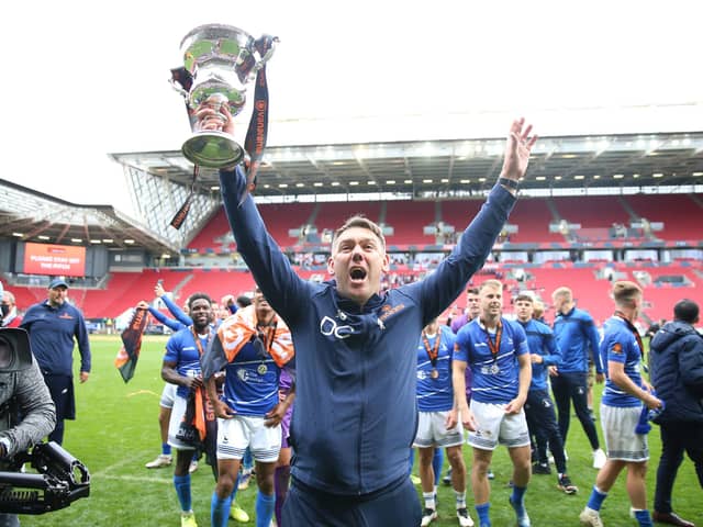 Hartlepool United manager Dave Challinor celebrates with the trophy after winning the shoot-out and promotion after the Vanarama National League play-off final at Ashton Gate, Bristol. PA.
