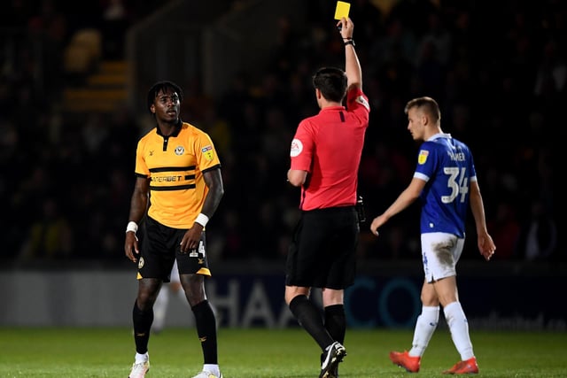 Adebayo Azeez receives a yellow card. Newport had 67 bookings and three reds.