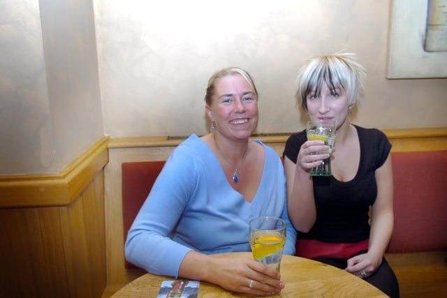 Two friends enjoying a night out at the Golden Lion pub in September 2007.