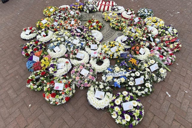 A collection of wreaths laid at the Workers' Memorial.