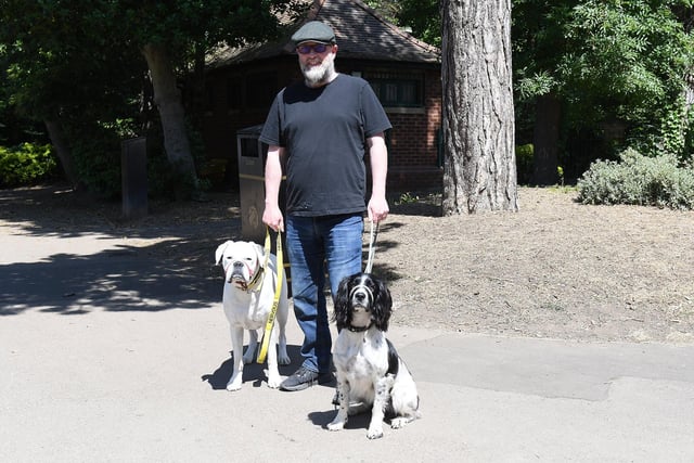 Tom Steven takes his dogs Malcolm and Joey out for a mid-afternoon stroll.