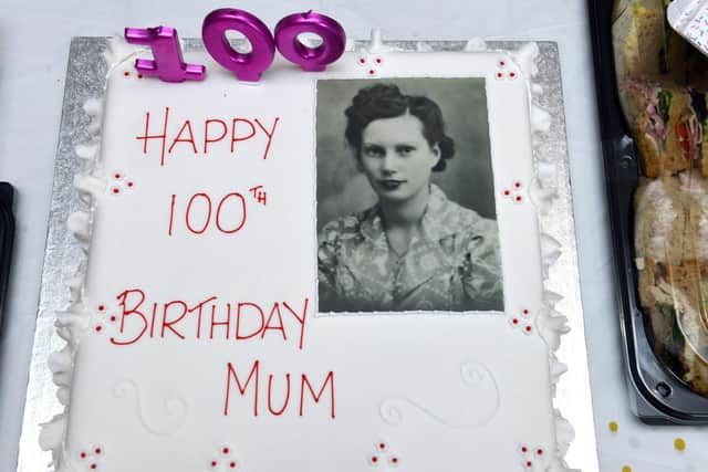 A picture of Sheila Dunn as a young woman on her 100th birthday cake.