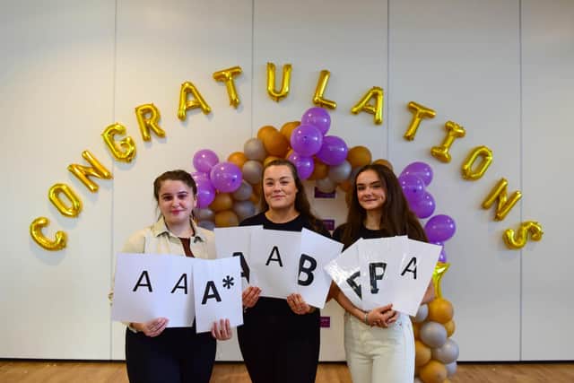 Left to right:  Lucy Lofton, Megan Forbes and Charlotte Bailey celebrating their A-level results this morning.