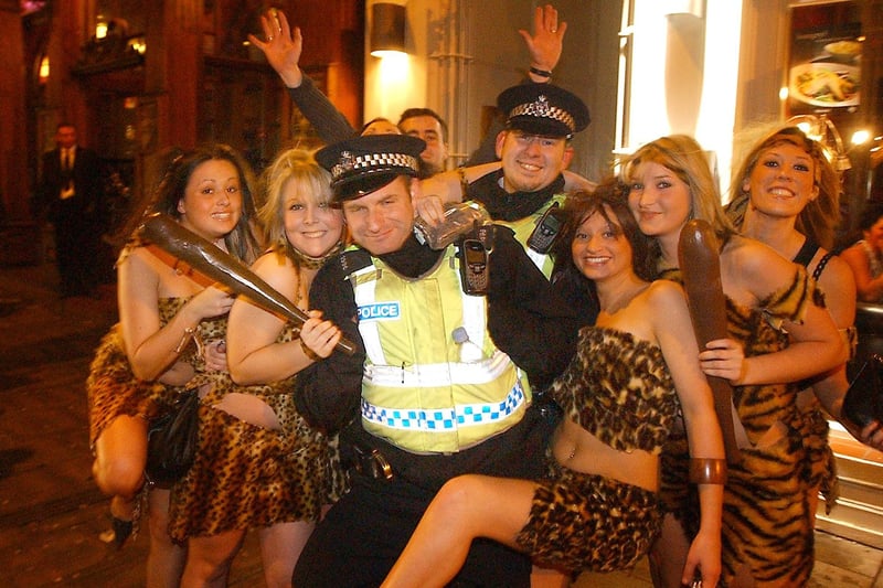 Police officers pose for a picture with women enjoying a night out in Hartlepool town centre in 2005.