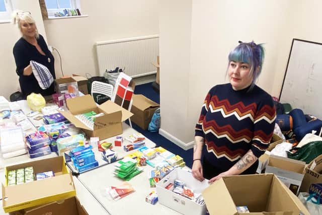 Kathy Dales (rear) and Laura Smith sorting donated items that will be sent to the Ukraine. Picture by FRANK REID