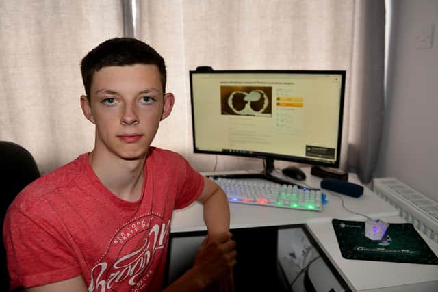 Joshua Readman next to a scan which shows the effect on his heart. Picture by FRANK REID