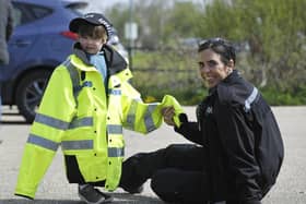 Hartlepool PCSO Julie Dobson with little Jack McCready as he dresses up during the community event at Summerhill. Picture by FRANK REID